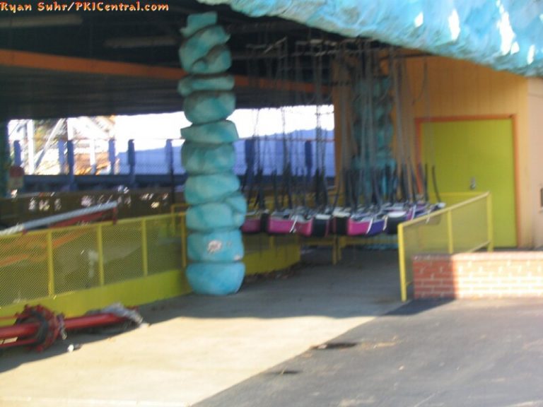 Pixie & Dixie swing set swings stored under the bumper car house.