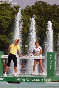 Kim Clijsters and Elena Dementieva play a tennis "match" inside the royal fountain to promote the upcoming Sony Ericsson WTA Tour.  2009